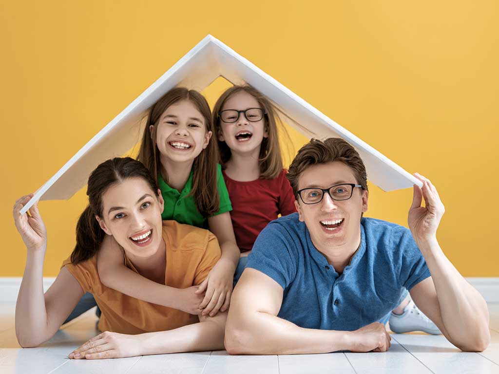 Happy family with roof
